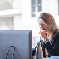 Concentrated woman looking at her odinator screen