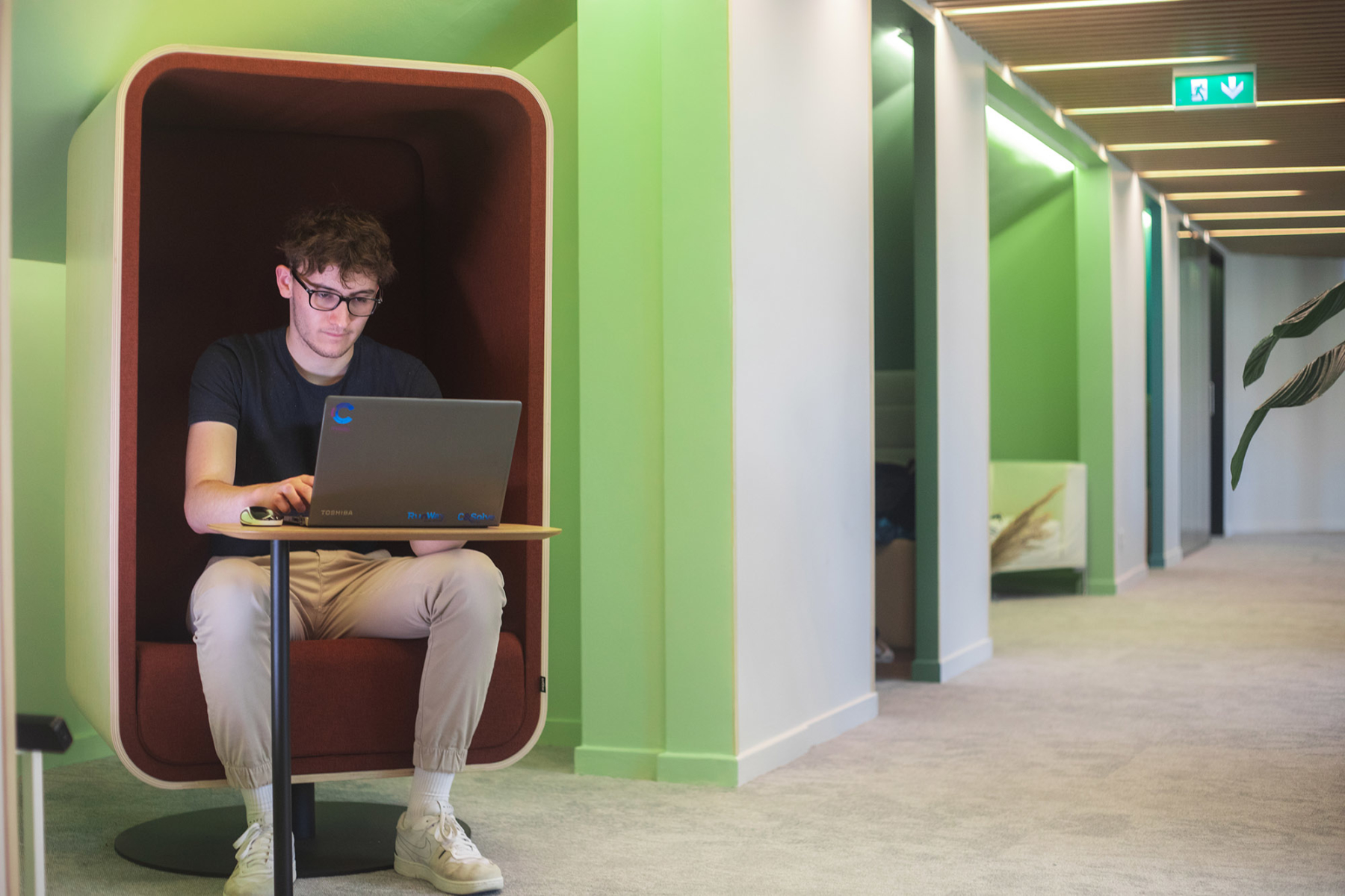 Attentive and hard-working young man in a pleasant relaxation area